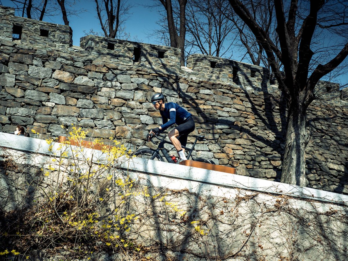 Male cyclist riding road bike abroad