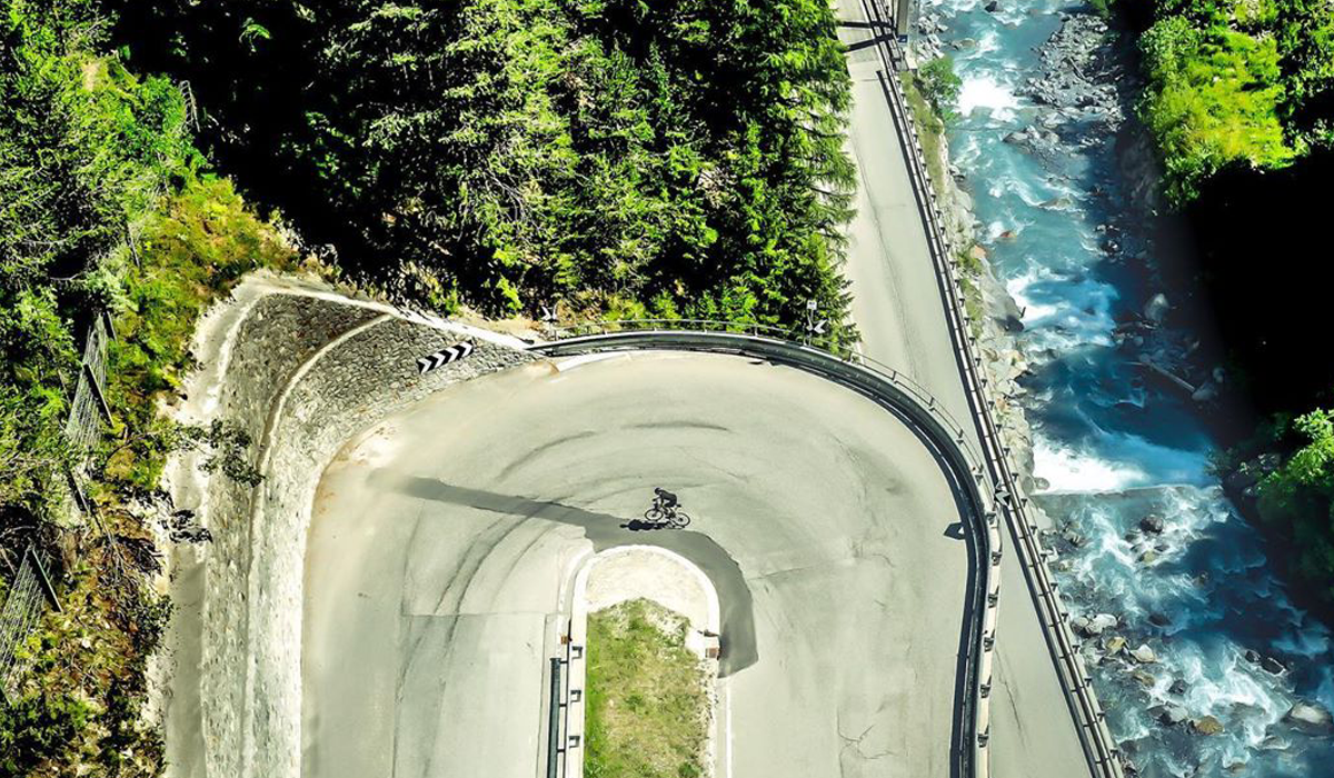 Cyclist riding the Stelvio, Italy