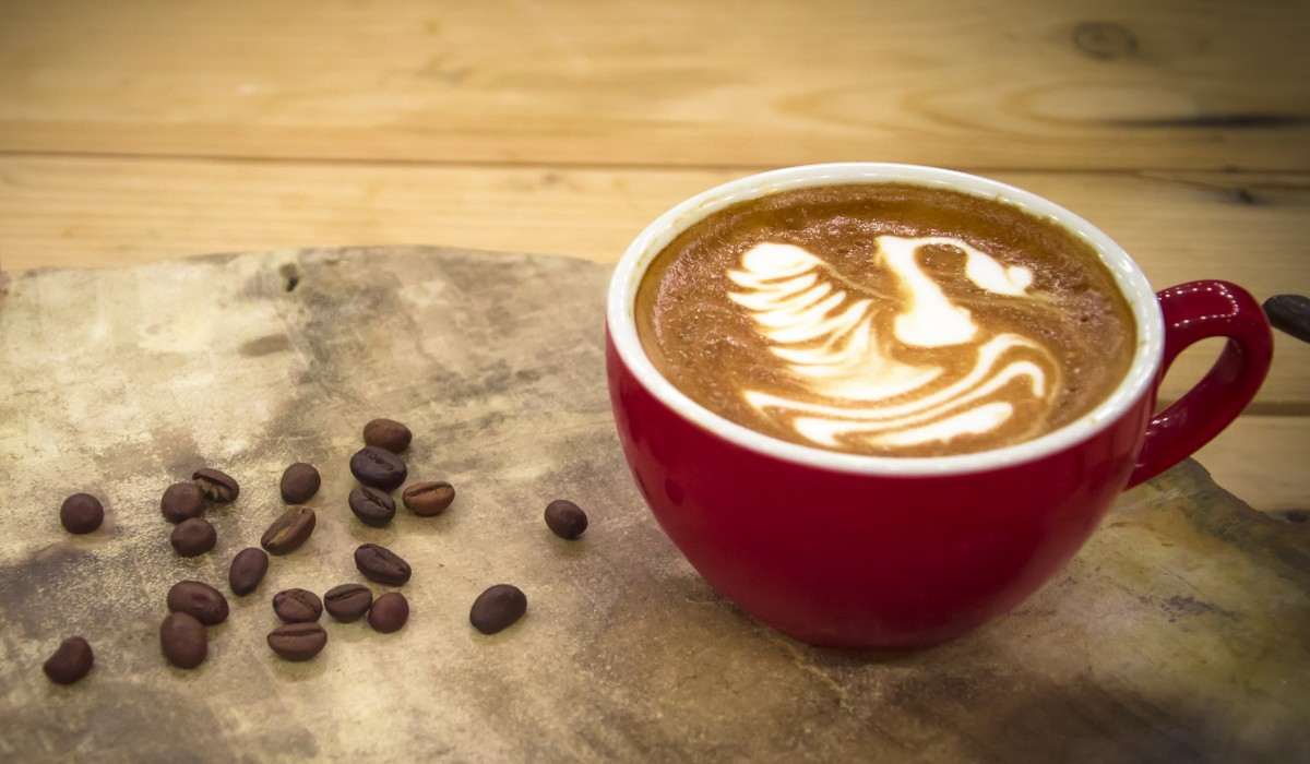 Coffee and coffee beans on table