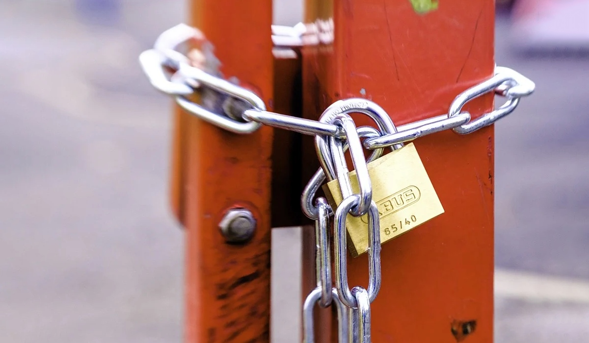 Lock chained to a gate