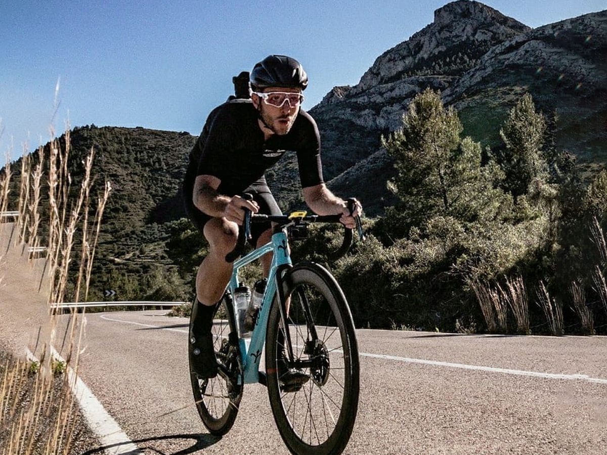 Cyclist riding road bike in mountain