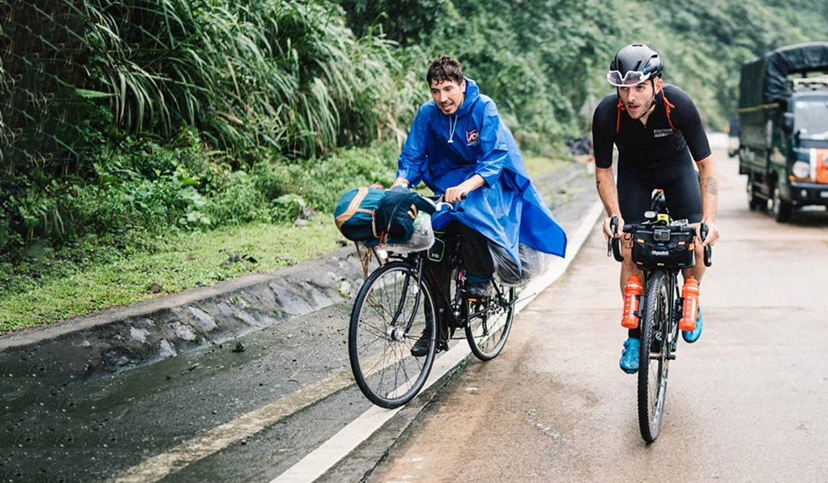 Two cyclists riding in Vietnam