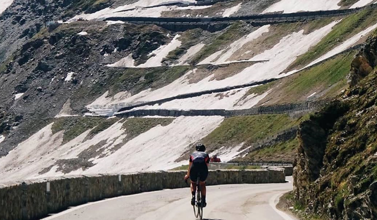 Cyclist riding up mountain