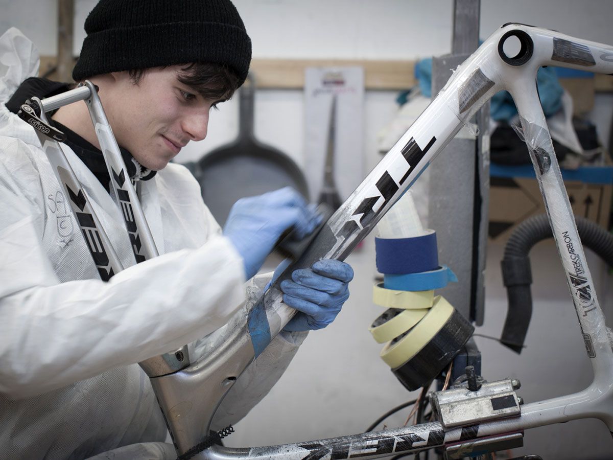 Man repairing carbon bike frame