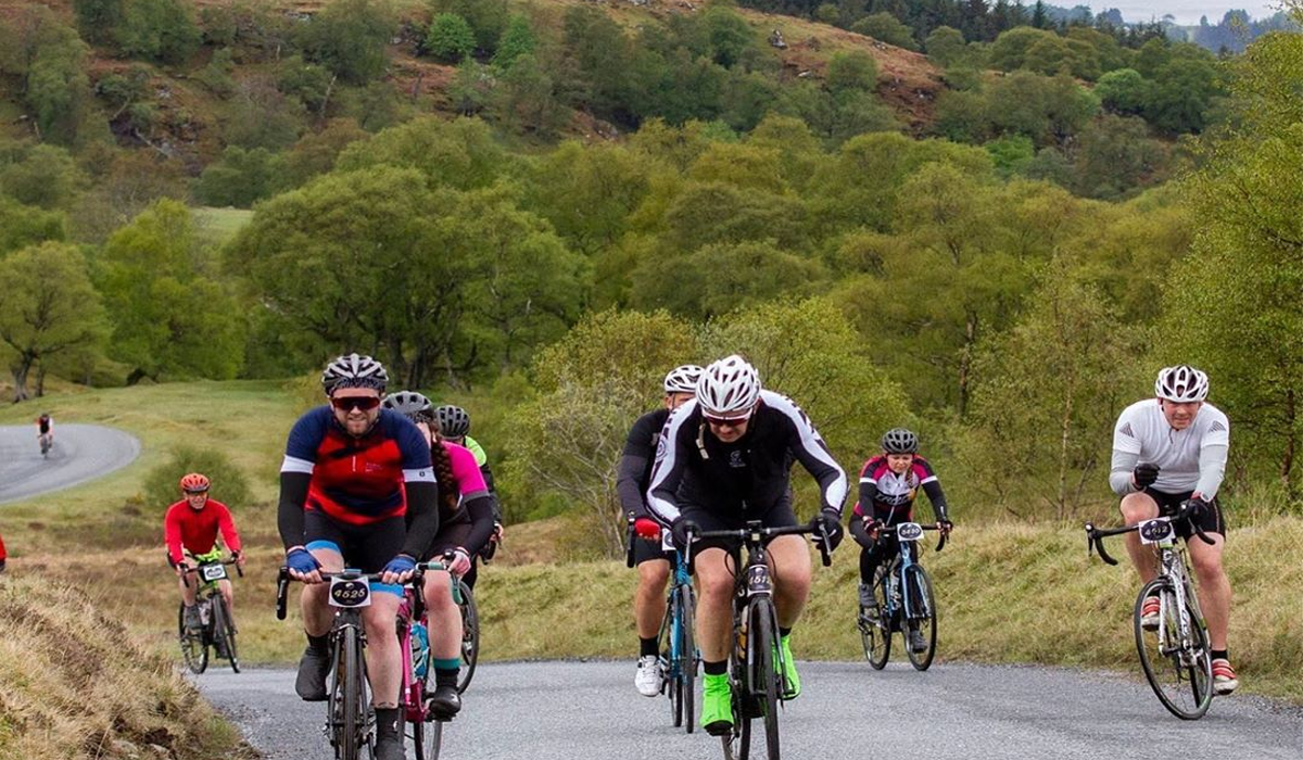 Cyclists riding uphill