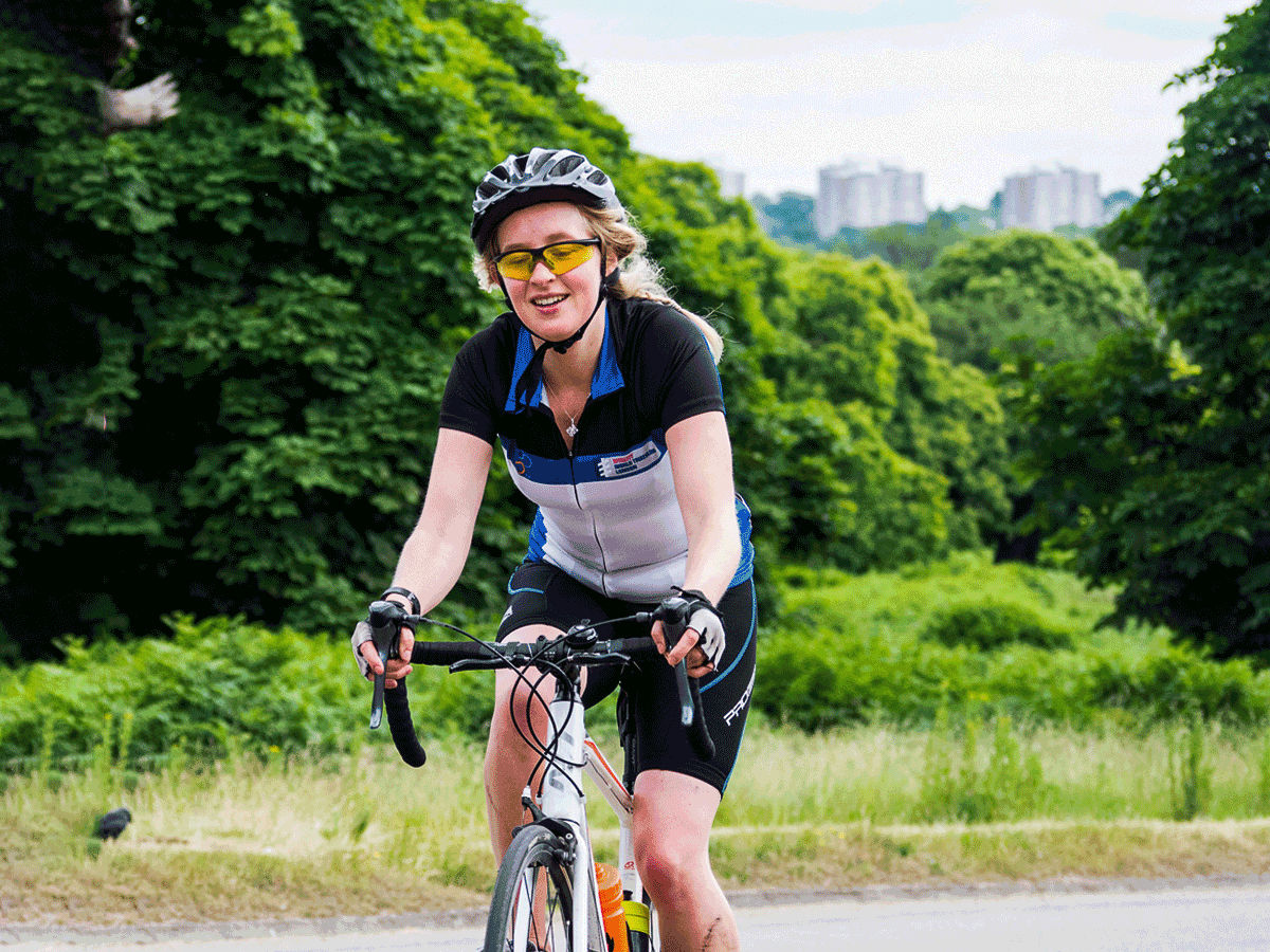 Woman cycling in London