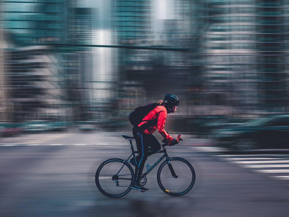 woman riding bike in city