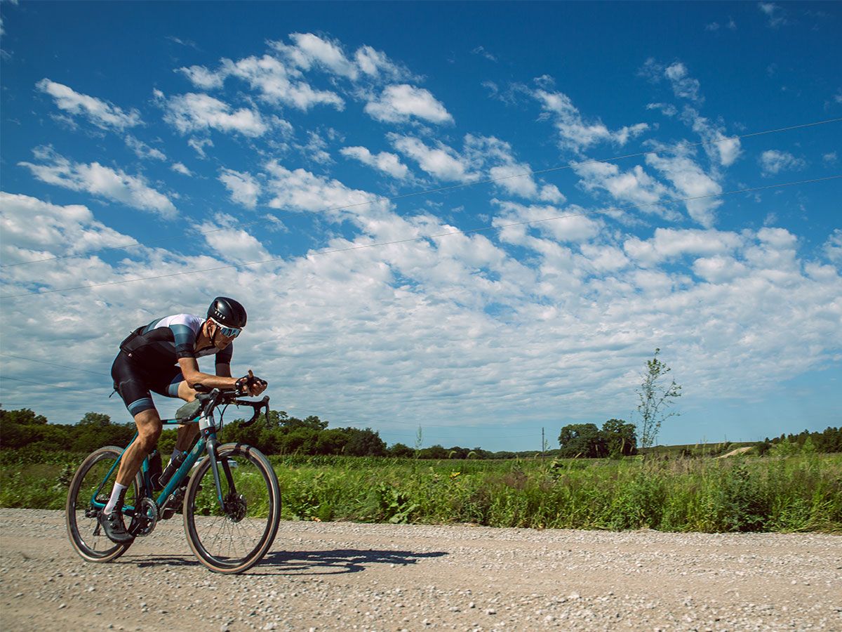 Cyclist riding on gravel at the Gravel Worlds