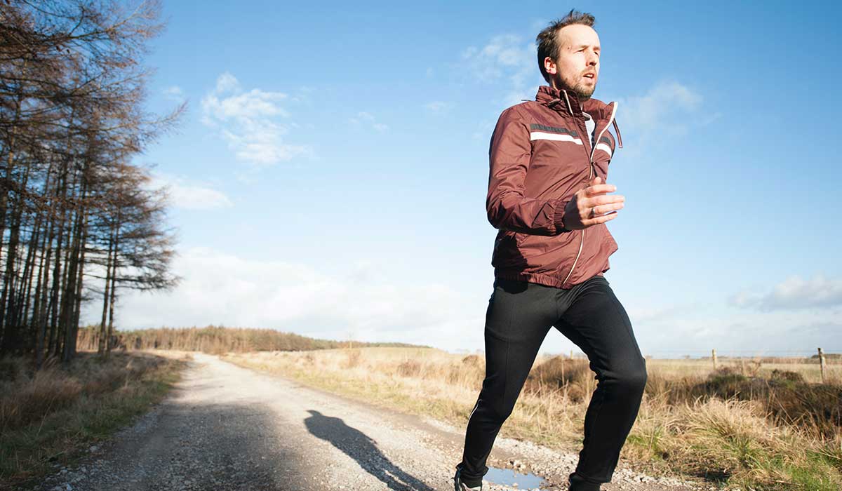 Runner running on gravel track