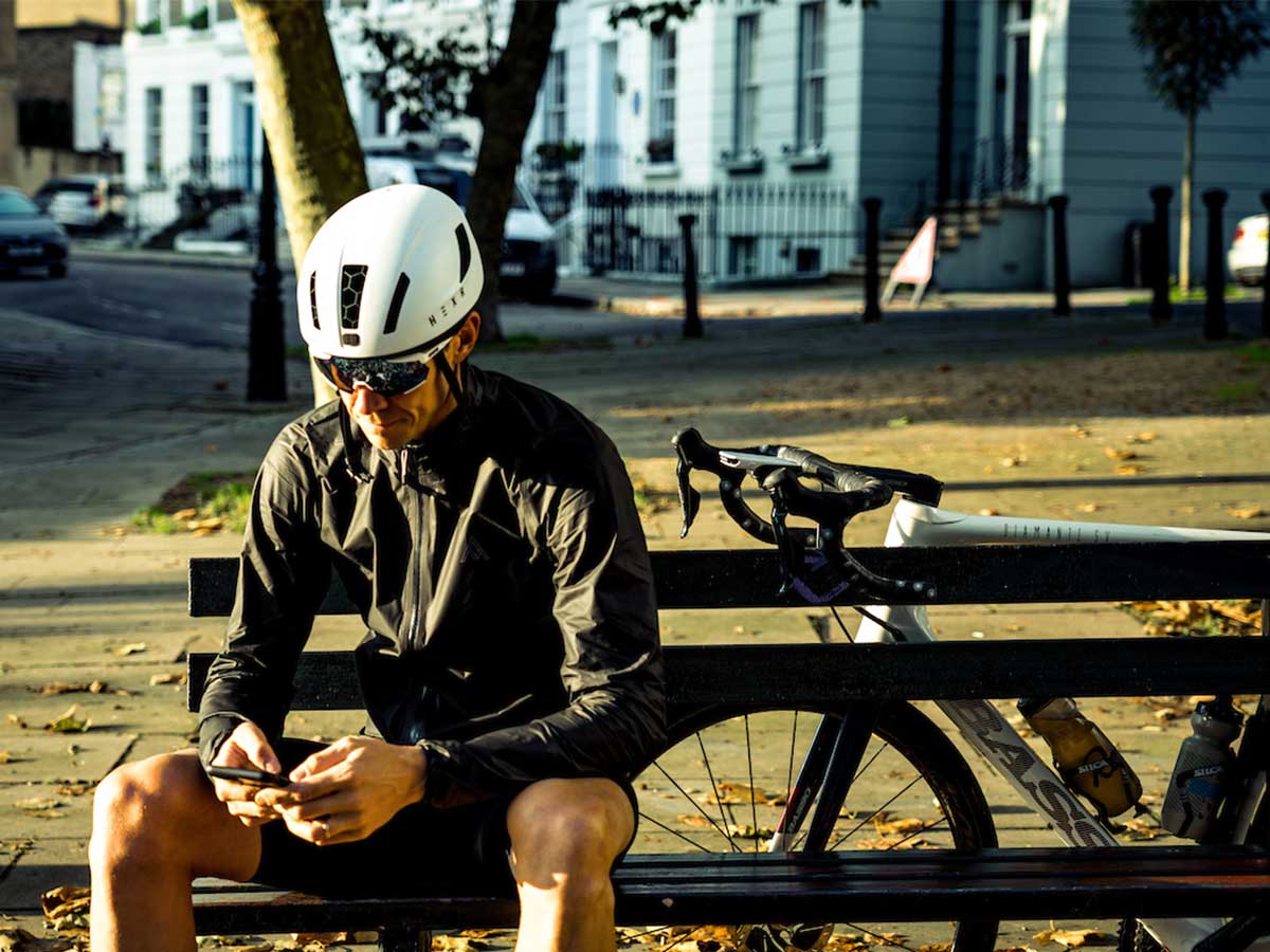 Cyclist sitting on bench in lockdown