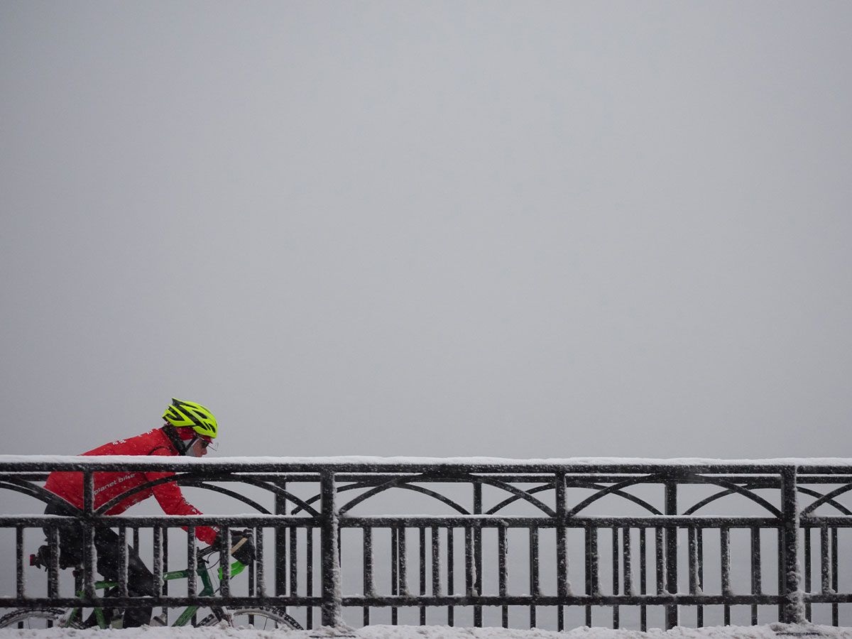 Cyclist riding in the snow