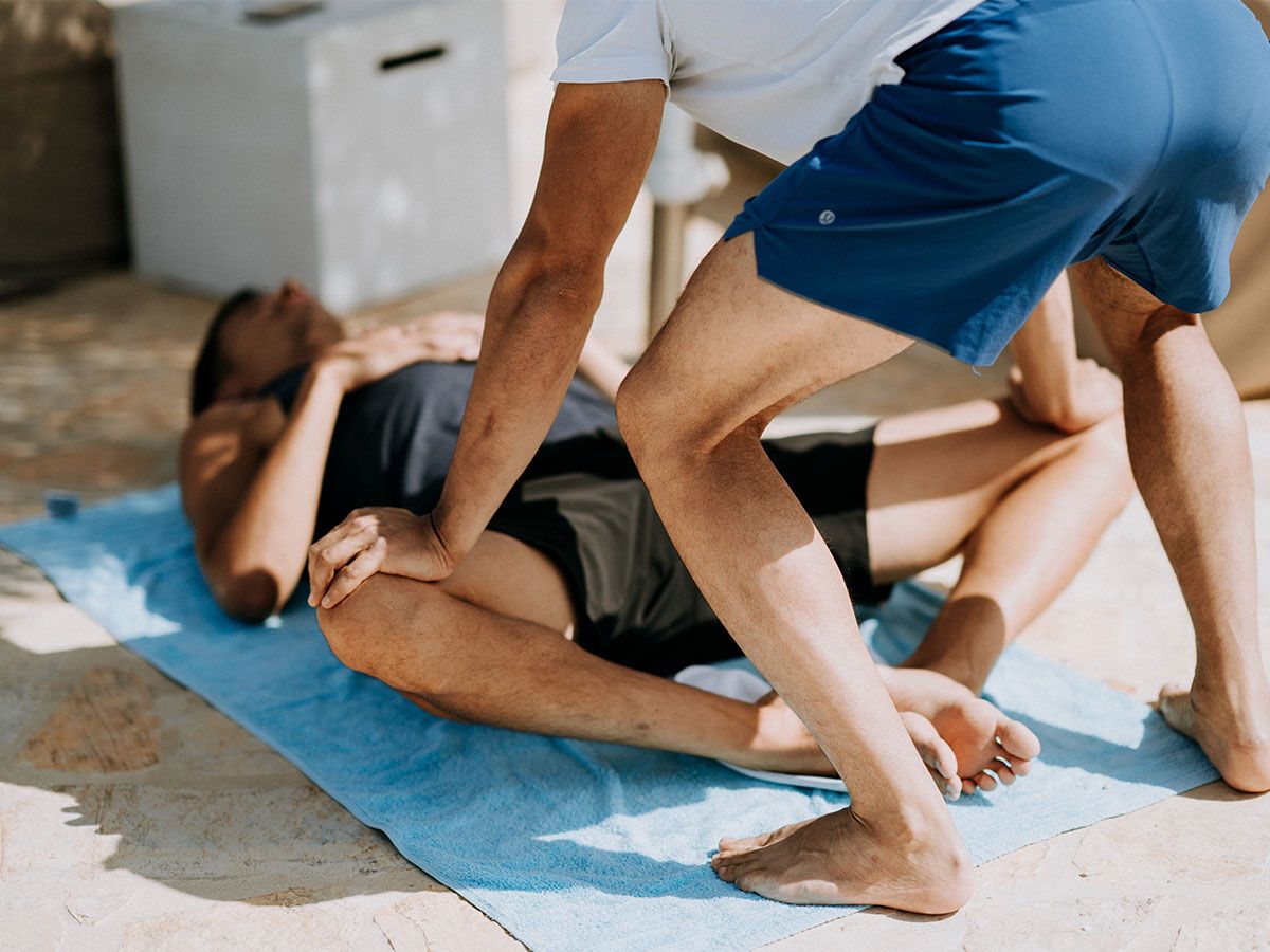 Two men stretching