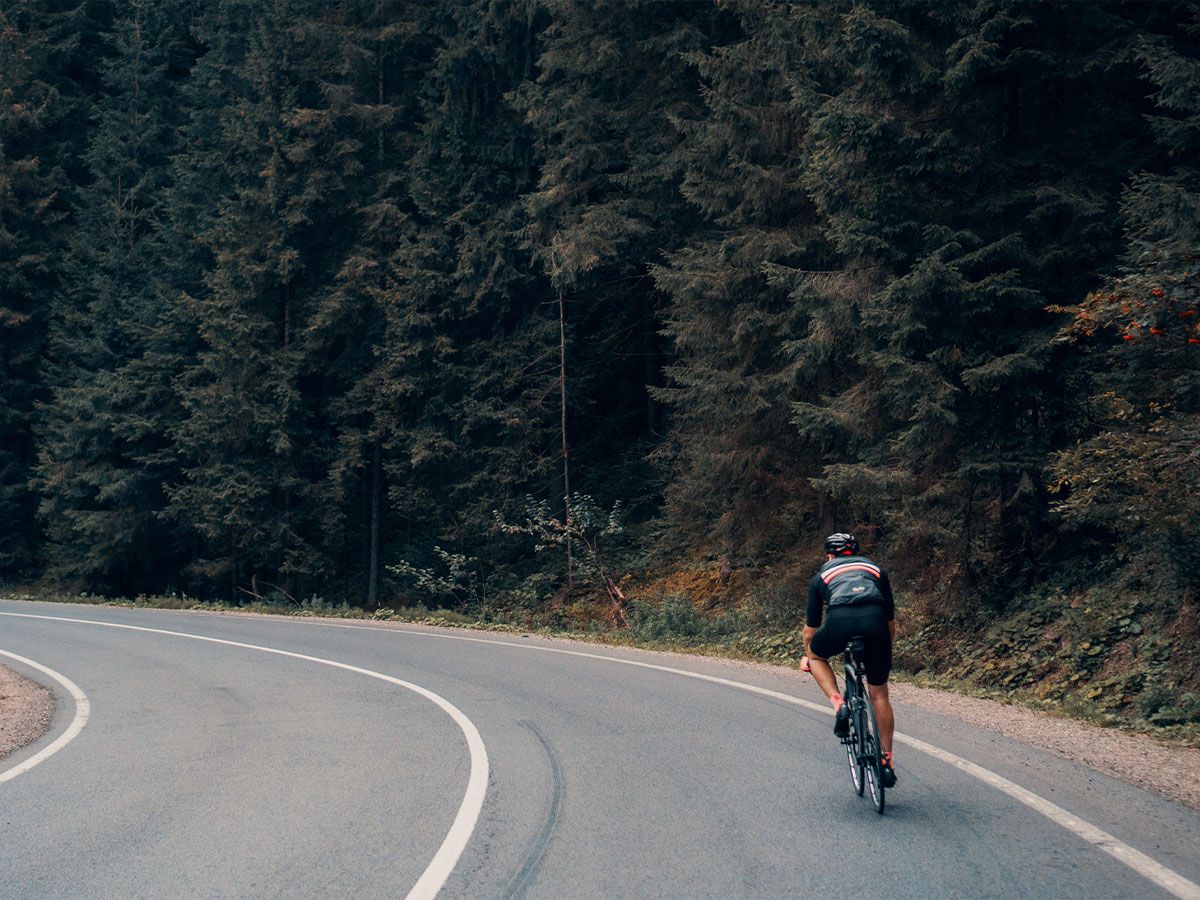 Cyclist riding down a descent