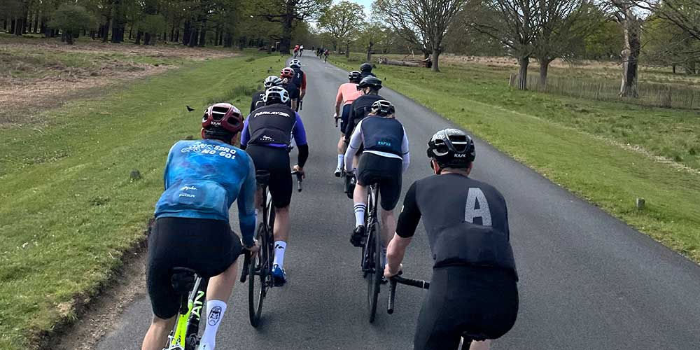 Cyclists cycling side by side